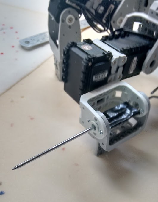 robot with needle for detecting landmines